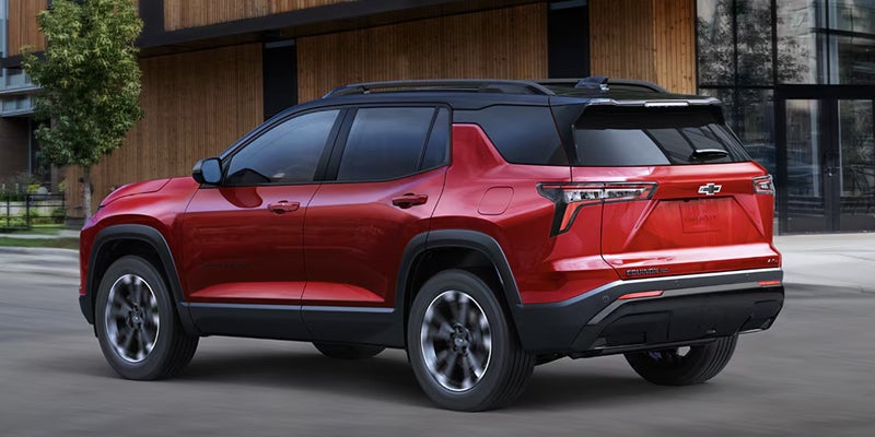 Rear three-quarter view of a red 2027 Chevrolet Equinox.