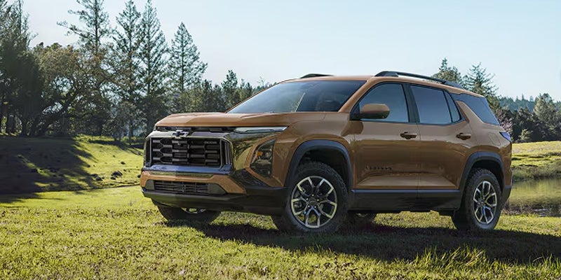 Brown 2027 Chevrolet Equinox shown from the front three-quarter angle outdoors.