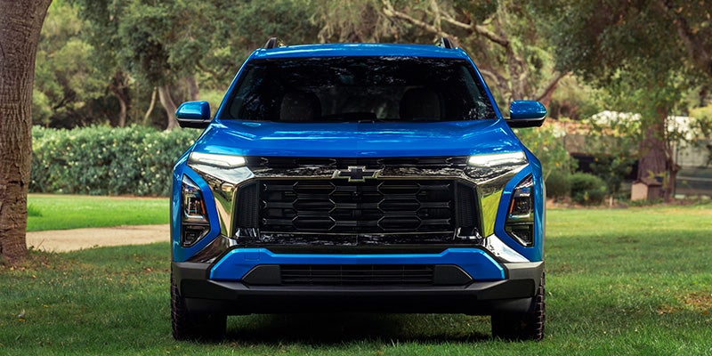 Front view of a blue 2027 Chevrolet Equinox showing its grille and LED lighting.