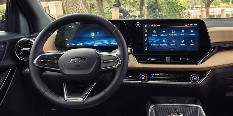 Steering wheel, digital driver display and infotainment touchscreen in a 2027 Chevrolet Equinox.