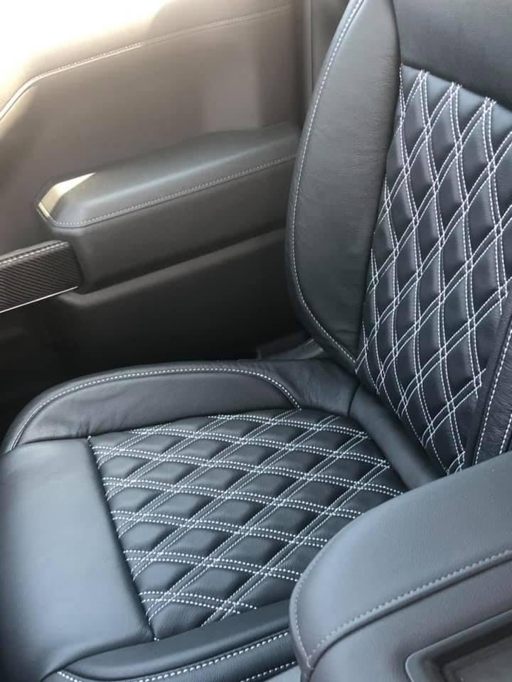 Custom seating inside an American Luxury Coach Chevrolet Silverado